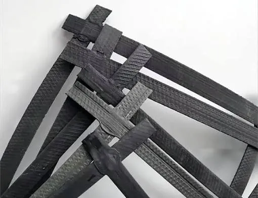 Steel-plastic composite geogrid reinforcement material