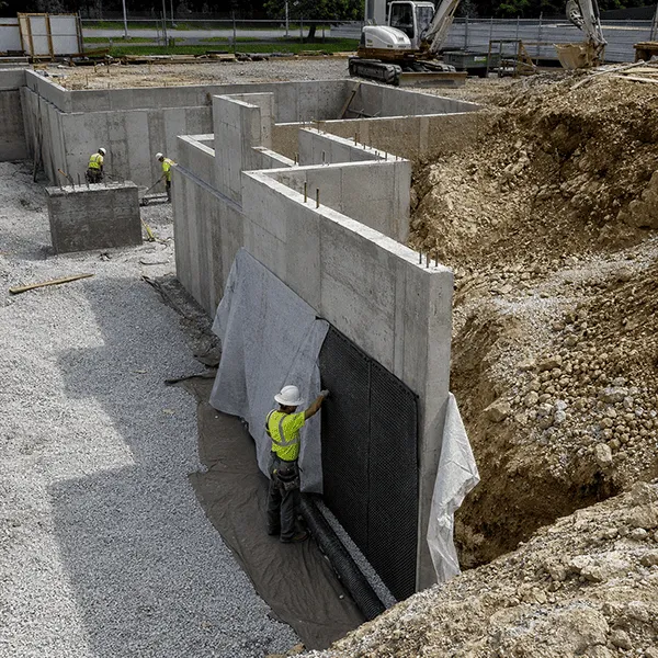 Geosynthetic protection and drainage for building foundations