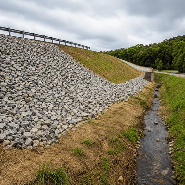 Geosynthetic slope protection and erosion control installation