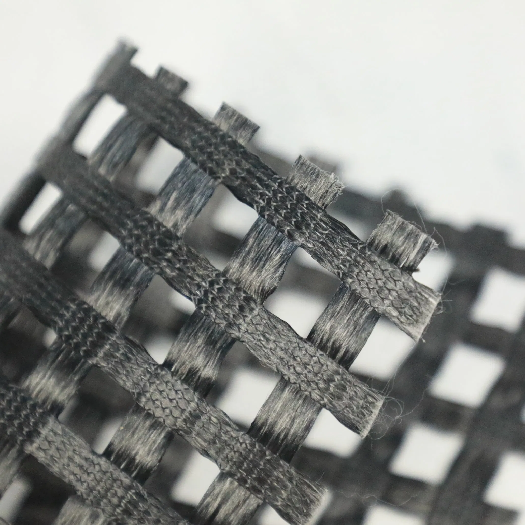 Warp-knitted polyester geogrid roll for soil reinforcement
