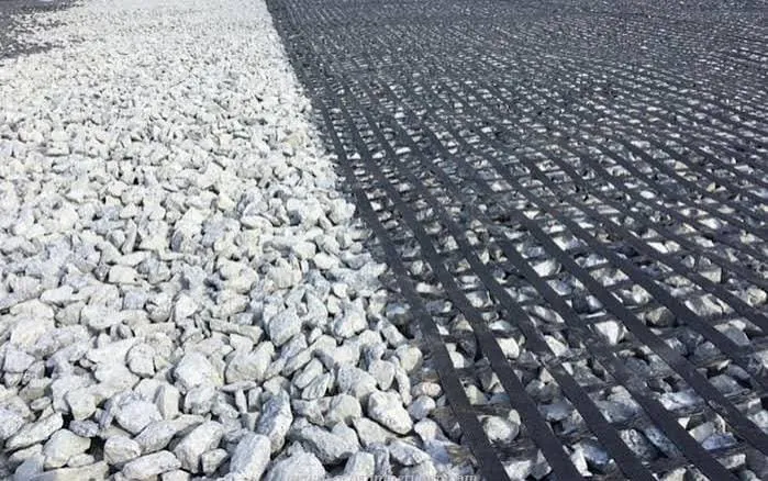 Fiberglass geogrid reinforcement installed during road construction